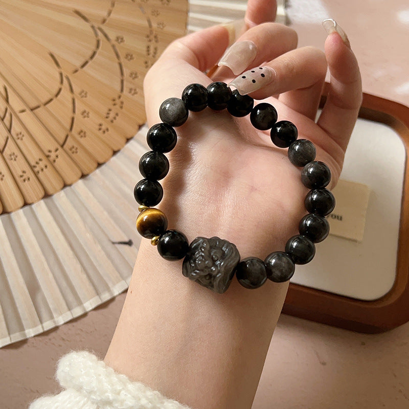 Bracelet obsidienne neige à breloque lion