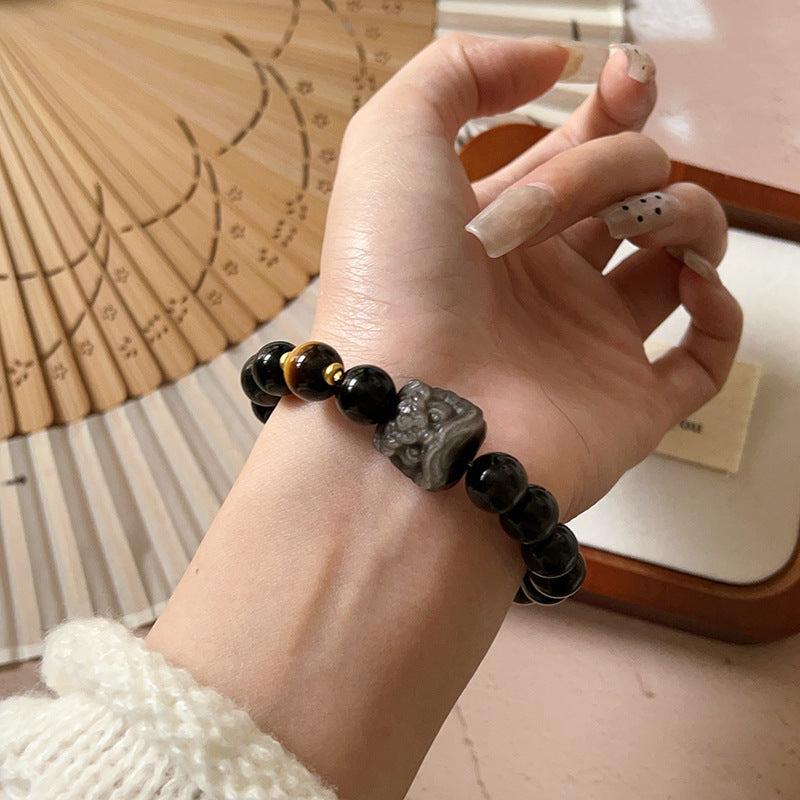 Bracelet obsidienne neige à breloque lion