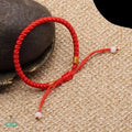 Bracelet porte bonheur fil rouge tressé