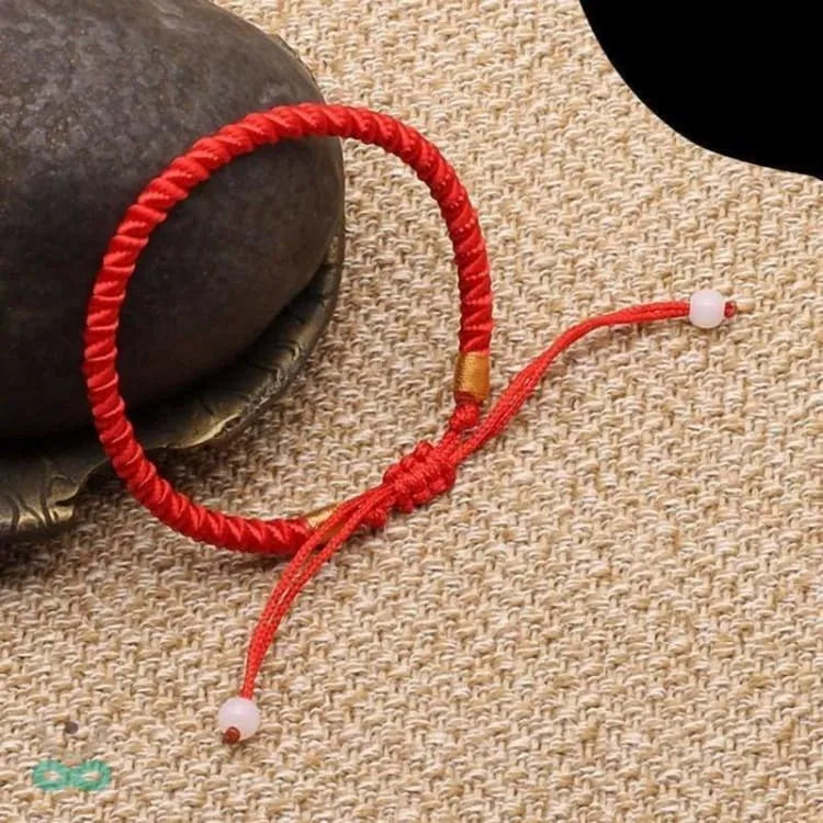 Bracelet porte bonheur fil rouge tressé
