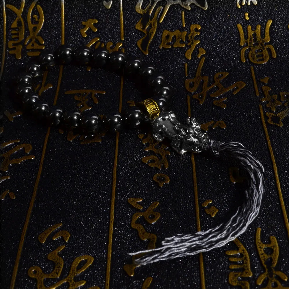 Bracelet tibétain hématite, trident et miroir