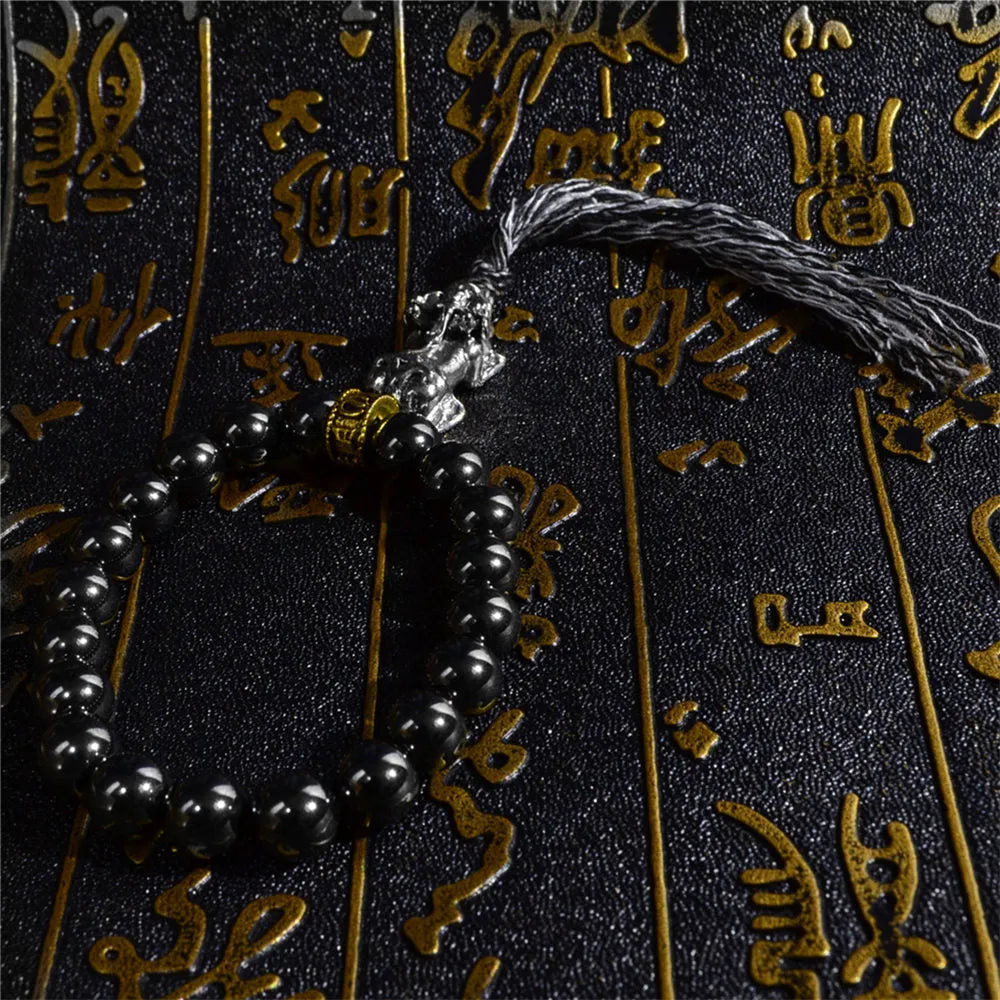 Bracelet tibétain hématite, trident et miroir
